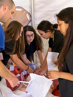 Advanced Emergency Medicine students engaging in a disaster medicine simulation on the Stanford Medicine campus