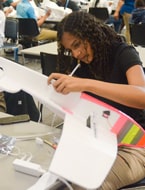 Aviation student constructing test airplane at Falcon Aerolab