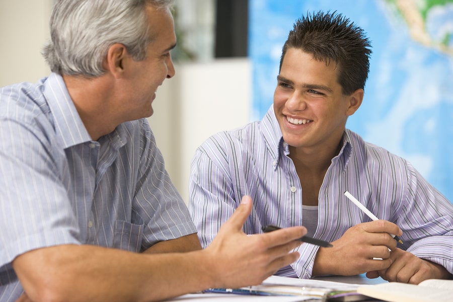 Teacher and high school student