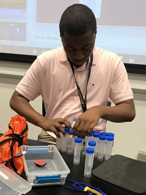 High school student engaged in an interactive workshop at Rice University's Aerospace & Aviation Academy