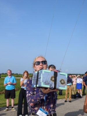 High school student building a can satellite at Rice University's Aerospace & Aviation Academy