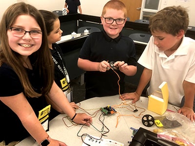 Students collaborate in a simulation to help citizens impacted by a recent natural disaster at NYLF Pathways to STEM Alumni