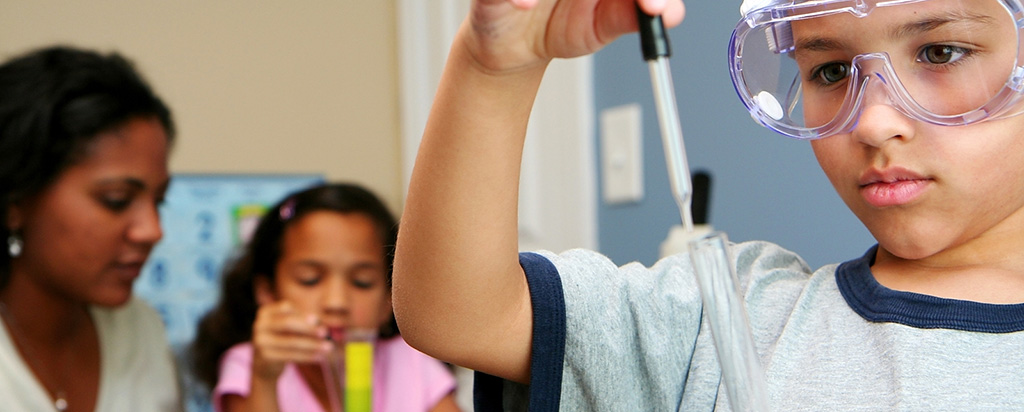 Elementary school student studies STEM chemistry