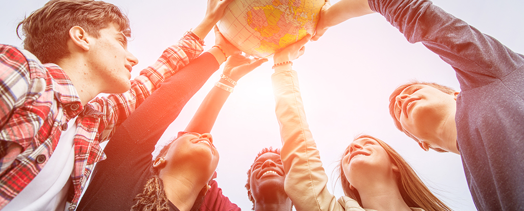 Teenagers Holding a Globe