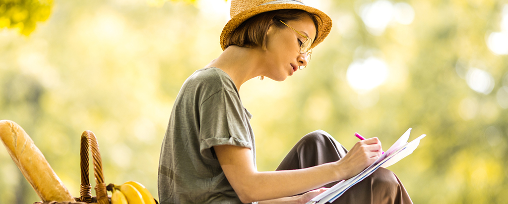 Teacher outside working on curriculum during summer