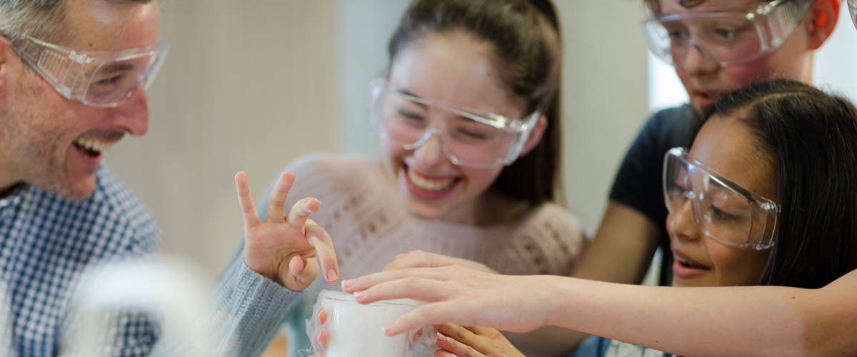 Students doing experiment with teacher