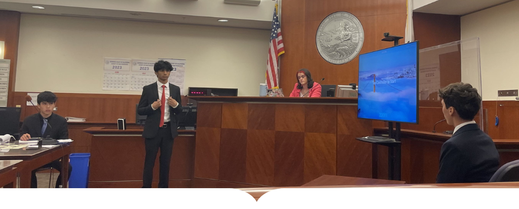 Student practicing law in courtroom