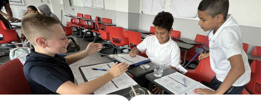 Young students work at table together