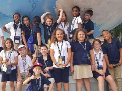 Students outside during local site visit at the National Young Scholars Program